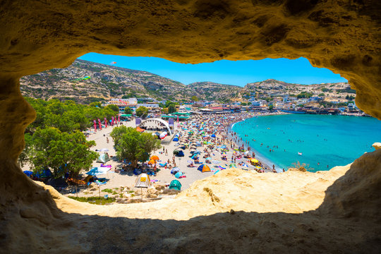 Matala beach through caves on the rocks that were used as a roman cemetery and at the decade of 70's were living hippies from all over the world, Crete, Greece
