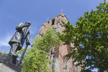 statue of troelstra next to oldehove tower in the centre of leeuwarden in the netherlands