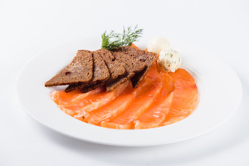 slices of salmon with brown bread (close)