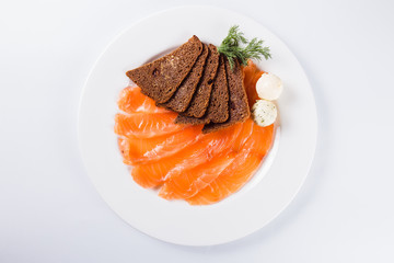 slices of salmon with brown bread (top view close)