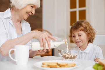 Lively sincere kid waiting for his cereal