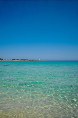Fototapeta premium Vacation on the sea, Crystal clear sea water texture with glare from the sun
