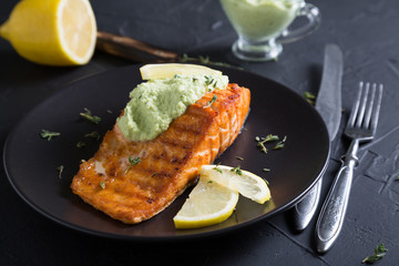 Grilled salmon with avocado sauce