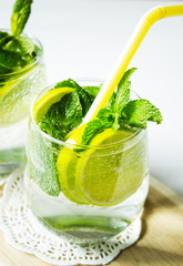 Non-alcoholic cocktail mojito on a wooden board. Selective focus. Vertical.