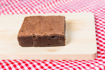 Chocolate Brownie cake on a dark plate