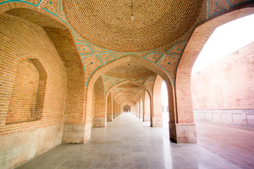Arched courtyard corridor of the Blue Mosque   a famous historic mosque in Tabriz, Iran.