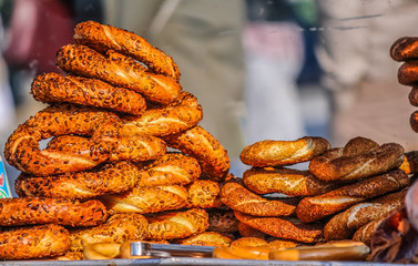 Turkish traditional bagel bread called Simit and other pastries in bench, close up shot