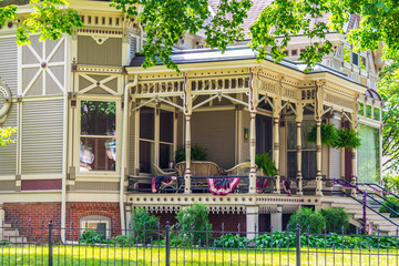 Victorian home decorated with patriotic flag buntings for Fourth of July