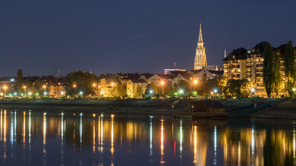 Fototapeta na wymiar River Drva coast reflection by night in city Osijek, Croatia