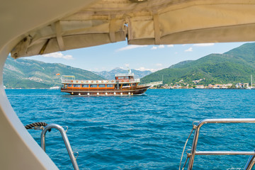 Fototapeta premium MONTENEGRO, TIVAT - MAY 27/2107: during good weather, many yachts stroll along the Boka Kotorska Bay.