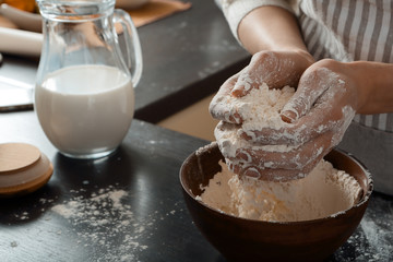 Fototapeta premium Preparing shef hands mixing dough on kitchen indoor