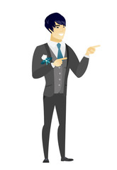 Young asian fiance pointing to the side.