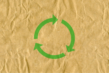 symbol for refuse reuse recycle with cardboard background - obrazy, fototapety, plakaty