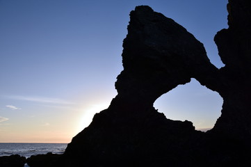 Sunrise at Australia rock in Narooma. The shape of Australia cut into the rock wall was accidental and was created when a ship was tied to the rock with large chains to prevent it from washing away.