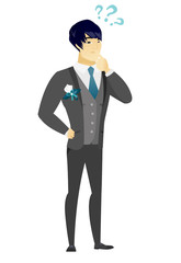 Thinking groom with question marks.