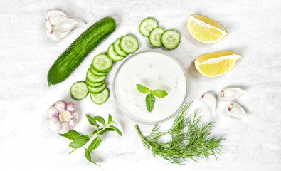 Tzatziki sauce ingredients Yoghurt mint dill herbs cucumber © LiliGraphie