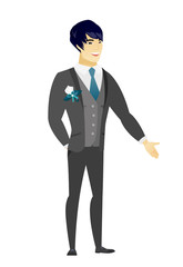 Asian groom with hand in his pocket.