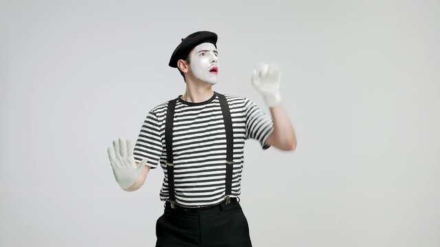 Mime behind an invisible wall