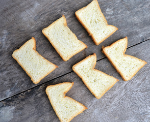 bread isolated on wooden background 