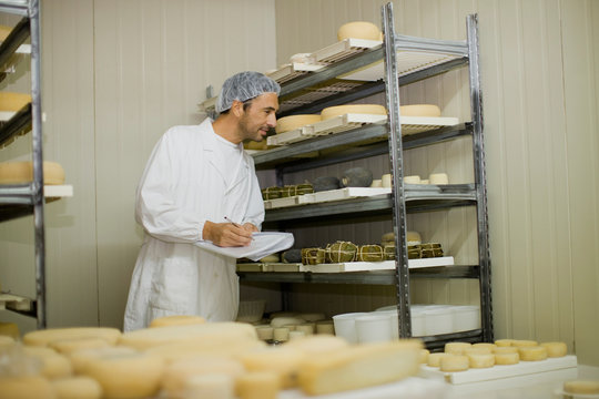 Worker at a cheese dairy