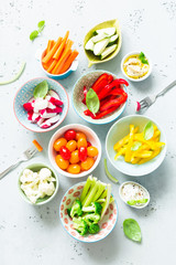 Vegetarian snacks - colorful vegetables and dips in bowls