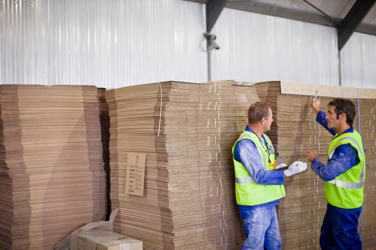 Workers talking in factory