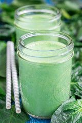 Detox green smoothie with spinach, vertical