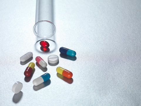Medicine capsules in test tube