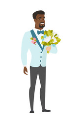 Young caucasian groom with a bridal bouquet.