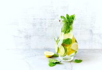 Lime, lemon  and mint infused water in a jug
