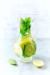 Lime, lemon  and mint infused water in a jug
