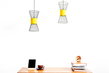 Gadget with mug and notepads on desktop