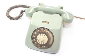 Old telephone isolated on white background