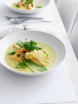Plate of chicken curry with vegetables