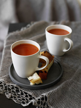 Plate of bread with cup of soup