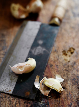 Garlic cloves on butchers knife