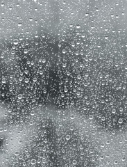 Naklejka na ściany i meble Rain drops on window. The beautiful texture.