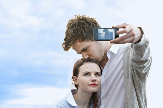 Couple taking picture of themselves