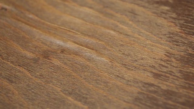 A sliding footage of a beautiful wooden surface texture.