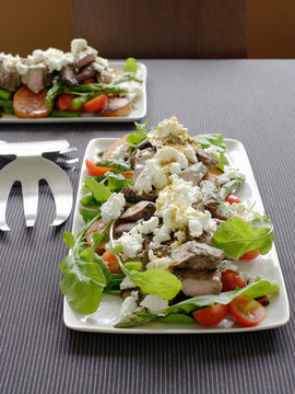 Plate of lamb with feta salad