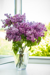 A bouquet of lilacs on the window