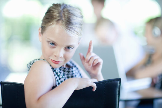 Girl playing businesswoman in chair
