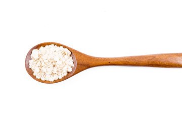 Fototapeta na wymiar oat flakes in wooden spoon isolated on white background
