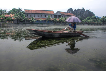 Fototapeta premium Tourists traveling in small boat along the River