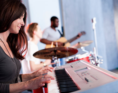 Band practising in recording studio