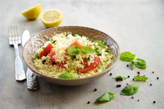 Couscous with parsley, tomato, lemon and olive oil. Traditional Arabic Salad Tabbuleh
