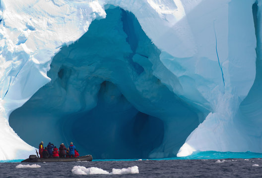 Boat and iceberg, ice floe in the Southern Ocean, 180 miles north of East Antarctica, Antarctica