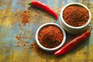 Red hot chili Cayenne pepper fresh and dried powdered spice, ready to use.