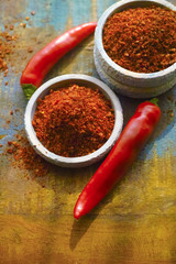 Red hot chili Cayenne pepper fresh and dried powdered spice, ready to use.