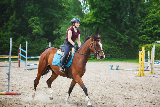 Horse rider is training in the arena